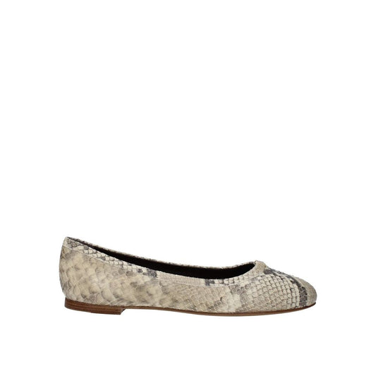Flat shoe with patterned toe cap on a white background